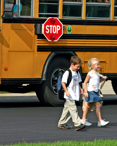 Photo of children leaving a school bus