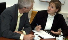 Photo of two business associates involved in a discussion