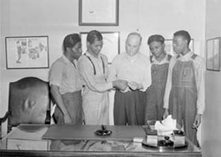 Photo of four of the Scottsboro boys with lawyer