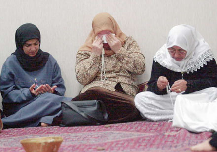women mourn the victims of the 9-11-01 attack
